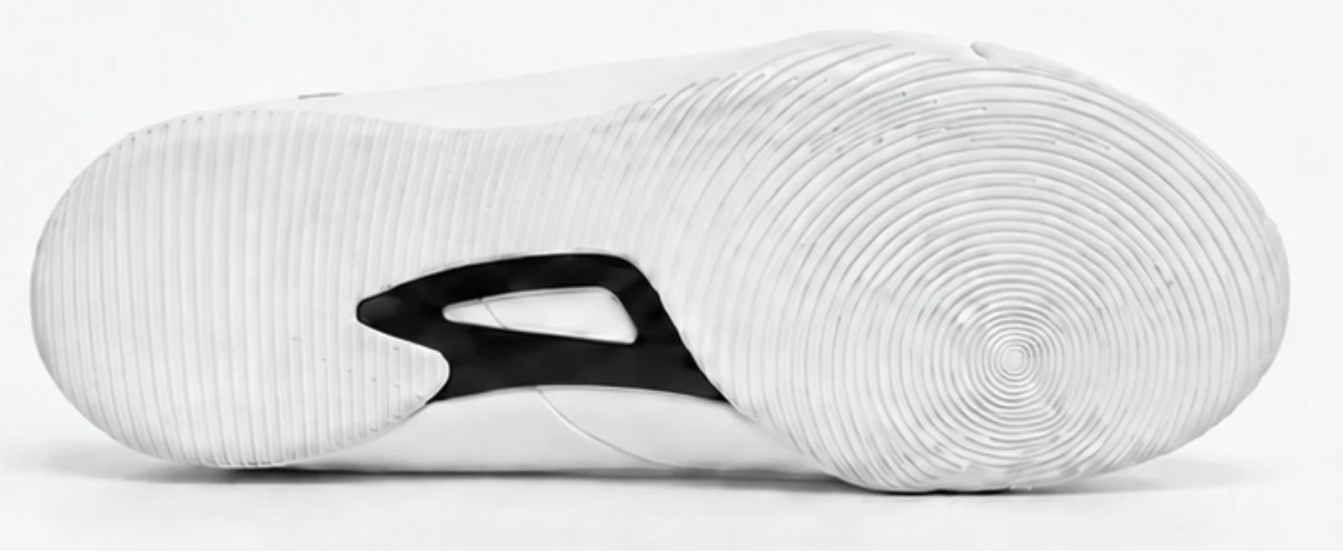 White boxing shoe outsole with concentric grooves and a black midfoot insert