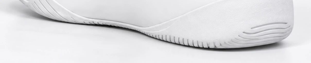 Low-profile white sole edge and heel perimeter
