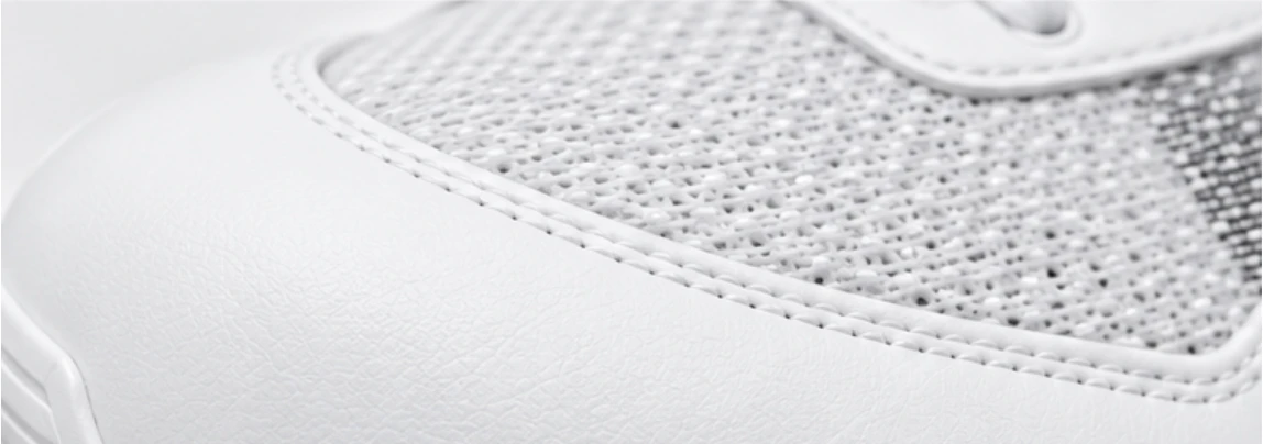 Close-up of the shoe panel join and white topstitching